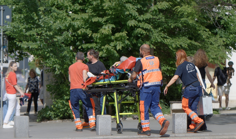 Emergency medical personnel in Bucharest, Romania, assisting a patient on a stretcher